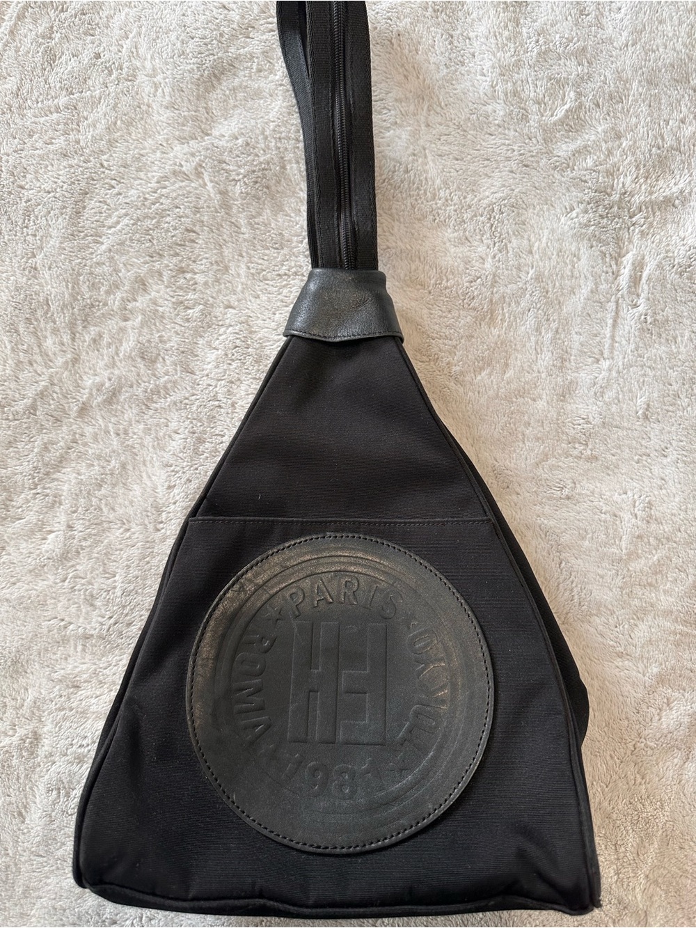 Black Triangle Sling Bag with Circular Logo